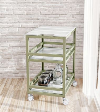 Standalone outdoor kitchen cart shown in an exterior setting, highlighting its mobility and storage capacity.